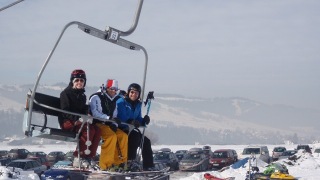 White Side Holidays Poland ski instructor Dawid taking his group up on their ski lesson at Czarna Gora ski area
