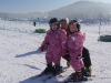 2 of our youngest guests learning to ski with one of our instructors Hanna