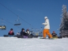 Gaz taking a kids snowboard lesson in Zakopane