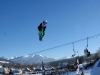 Gaz competing in a big air contest, mid rodeo flip in Witow Snow Park